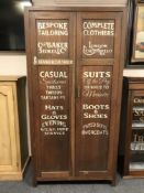 An early twentieth century and later oak cabinet 'Bespoke Tailoring'