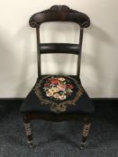 An antique mahogany dining chair