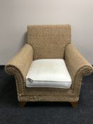 A wicker conservatory armchair