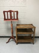 An oak three tier trolley together with a contemporary music stand