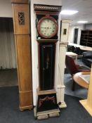 An early 20th century painted long cased clock with pendulum and weights