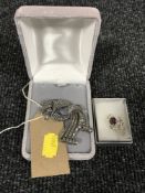 A silver marcasite brooch together with a brooch of a thistle