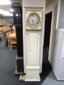 An early 20th century painted long cased clock with pendulum and weights