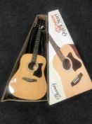 A boxed Ibanez acoustic guitar in carry bag together with two wall canvases;