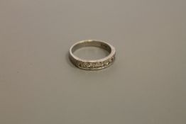 A diamond set half-eternity ring,