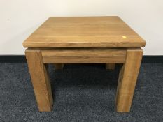 A contemporary oak lamp table