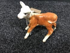 A Beswick figure of a calf
