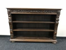 A set of heavily carved oak open shelves CONDITION REPORT: Scuffs,