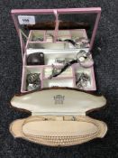 A jewellery box containing a yellow metal cameo ring and a small quantity of costume jewellery,