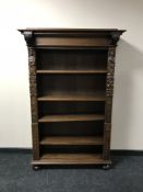 A set of heavily carved oak open shelves CONDITION REPORT: Small broken area to the