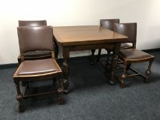 A 1930's oak pull out table and 4 chairs
