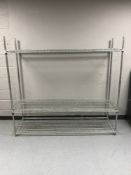 A set of metal four tier shelves