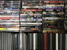 Two luggage cases and a crate containing approximately 200 DVD's and box sets