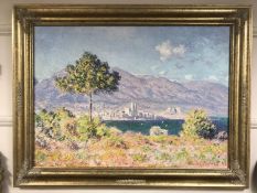 An Artagraph reproduction : Coastal landscape with mountains beyond, framed.