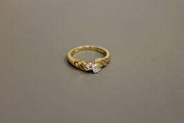 An 18ct gold two-stone diamond ring, approximately 0.2ct, size M/N.