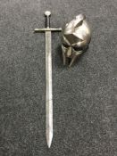A reproduction Gladiator helmet and a reproduction broad sword