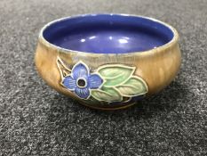 A Royal Doulton Lambeth pottery bowl with flower decoration