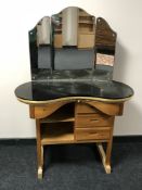 A pine kidney shaped dressing table with mirror