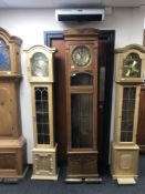 An early 20th century oak cased regulator clock with brass dial,