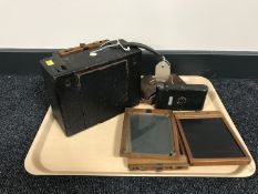 A plate camera with plates together with a Rollette camera