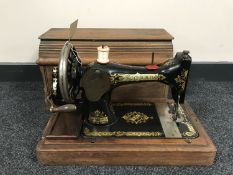 A mahogany cased Singer hand sewing machine
