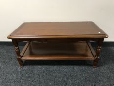 An Ernest Menard mahogany two tier coffee table