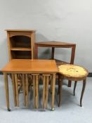 A set of teak open shelves together with a teak table,