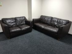 A brown leather three seater settee and matching two seater settee