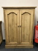 A reclaimed pine two door cupboard