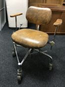 A mid 20th century industrial swivel machinist's chair