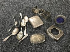 A box of assorted sterling silver items including cigarette case, photo frame, jar lid,