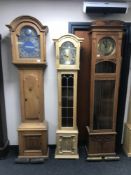 A blonde oak cased Tempis Fugit long case clock,
