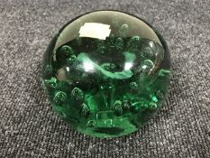 A large antique green glass dump with bubble inclusions