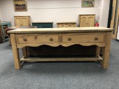 A reclaimed pine farmhouse dresser fitted with two drawers
