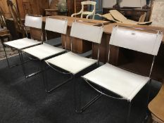 A set of four mid 20th century steel and white leather stitched dining chairs, width 45 cm each.