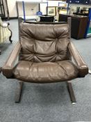 A Scandinavian brown leather lounge chair, height 81 cm.