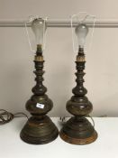 A pair of French brass bound walnut table lamps.