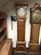 An antique continental pine gilded long case clock,