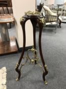 A French ormolu mounted mahogany jardiniere stand, height 87 cm.