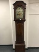 A late nineteenth century inlaid mahogany longcased clock with silvered dial