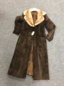 A mid twentieth century fur lined brown suede lady's coat.