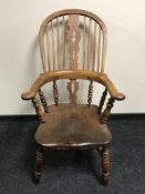 A 19th century elm Windsor armchair,