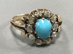 An antique turquoise and diamond cluster ring, size M, weight 3.5g.