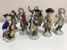 A group of seven Sitzendorf monkey band players, height 14 cm.