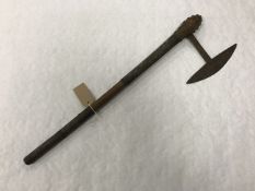 A 19th century Zulu tomahawk, with wired grip and studded head, length 62 cm.