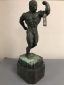 A bronze figure - Body Builder, on marble socle, height 54 cm.