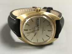 An 18ct gold Gentleman's Omega Constellation watch, boxed with Omega leather strap.