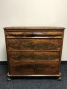 A 19th century mahogany four drawer chest, on scroll feet,
