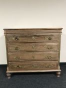 A 19th century mahogany four drawer chest, with Rococo style handles,