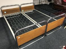 A pair of mid twentieth century chrome framed bed frames, each width 86.5 cm.
